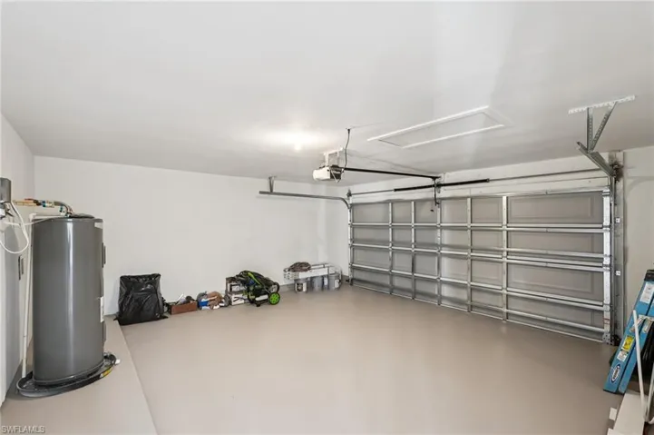 Garage featuring electric water heater