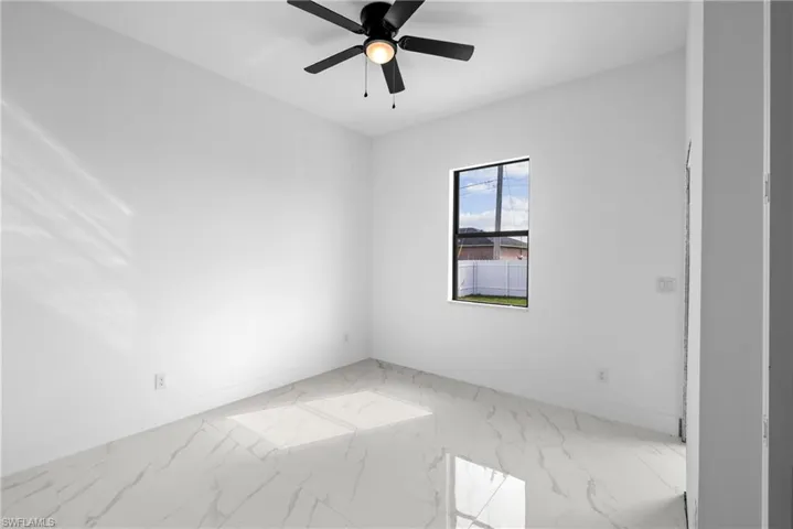 Spare room featuring ceiling fan