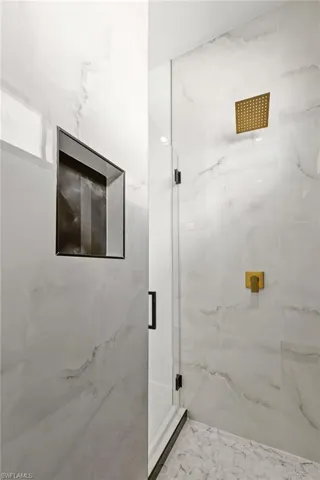 Bathroom with a shower with door