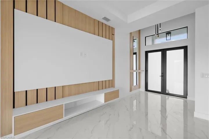 Entrance foyer featuring french doors