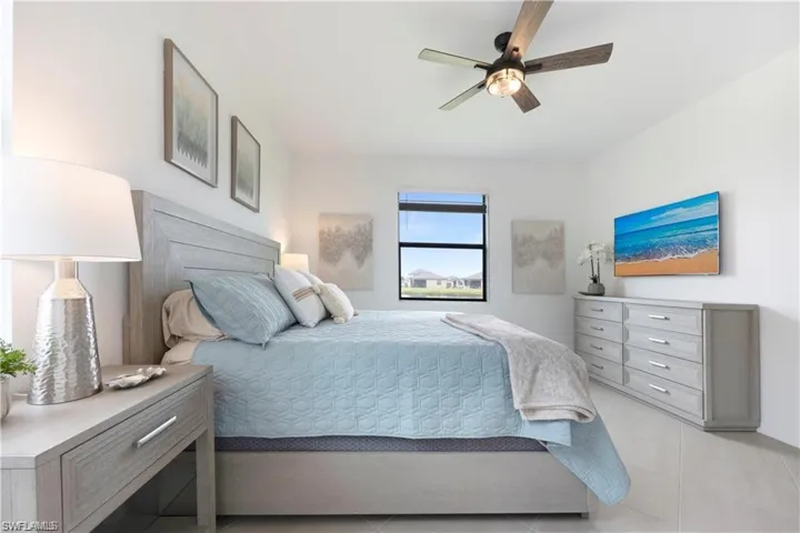 Bedroom featuring a ceiling fan and light tile patterned floors
