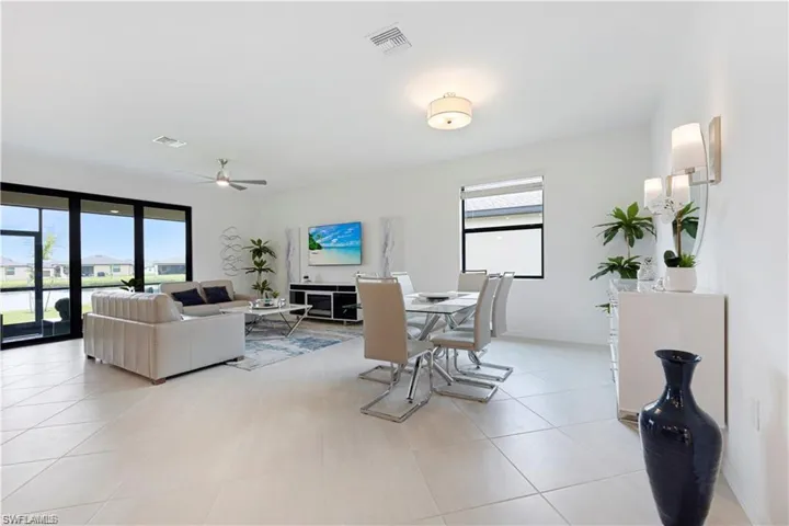 Dining room featuring a ceiling fan and light tile patterned floors