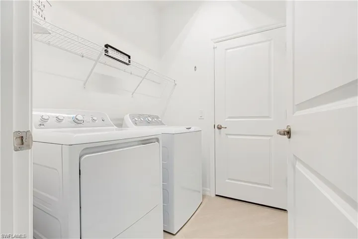 Laundry area with washing machine and clothes dryer