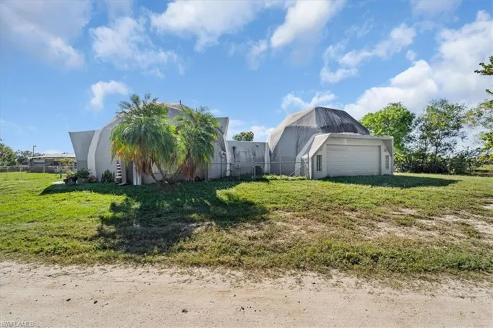 View of yard featuring a garage