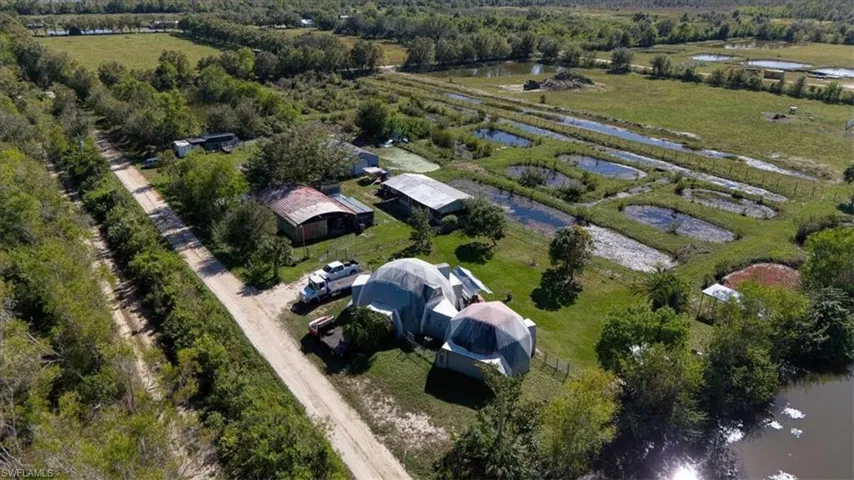Aerial overview of property's location featuring a large body of water and rural landscape