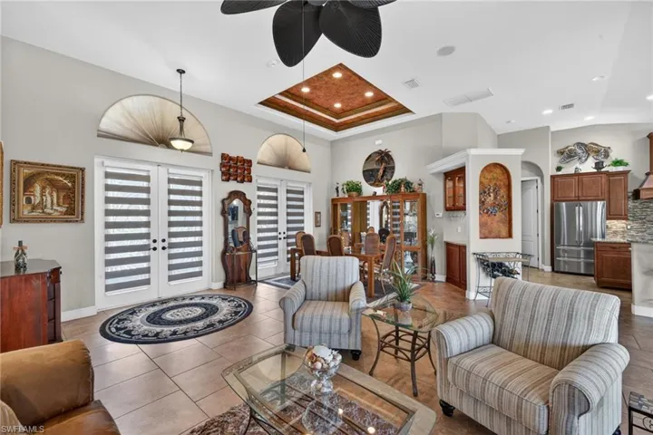 Living space with dining and front entry way in the background