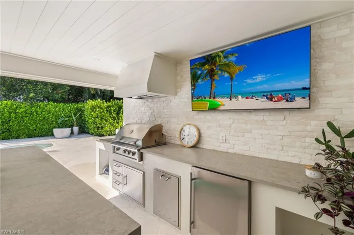 View of patio with exterior kitchen