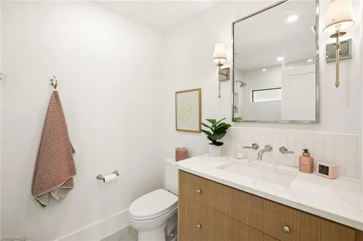 Bathroom with vanity and a shower