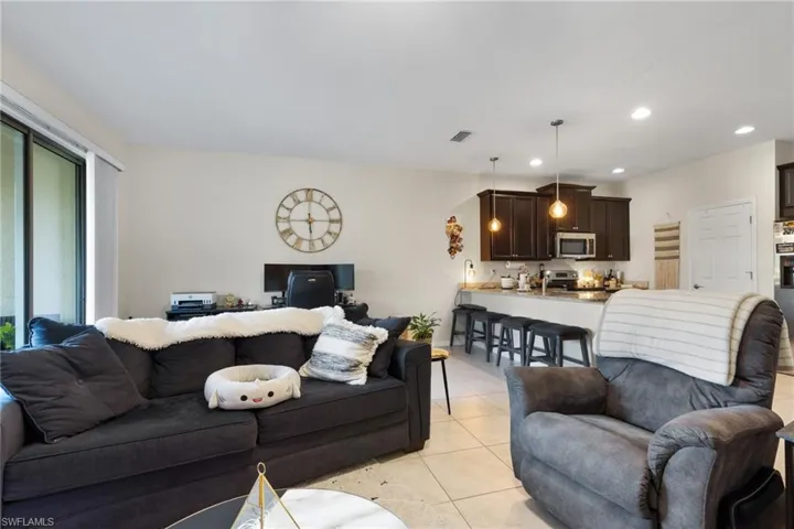 Living room featuring light tile patterned floors