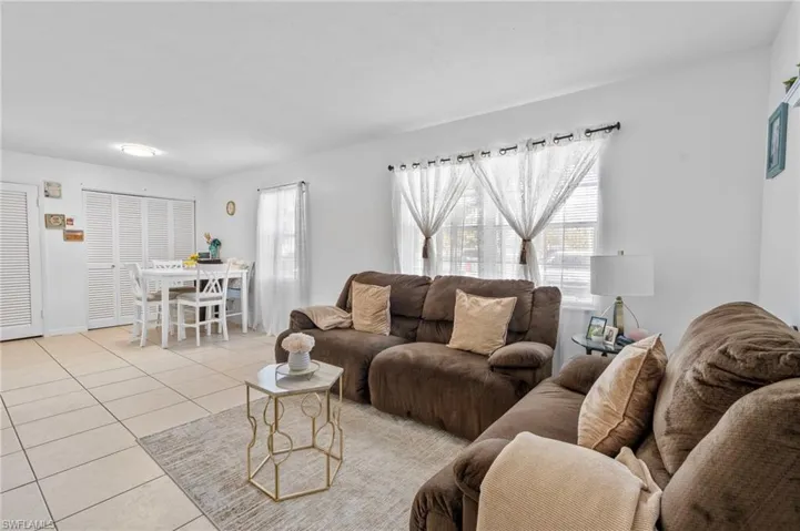 Living area with light tile patterned floors