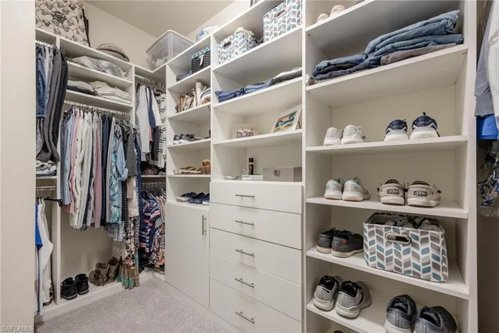 Walk in closet featuring carpet floors