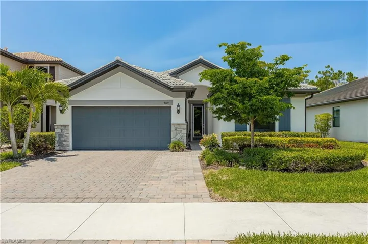 View of front of property featuring a garage