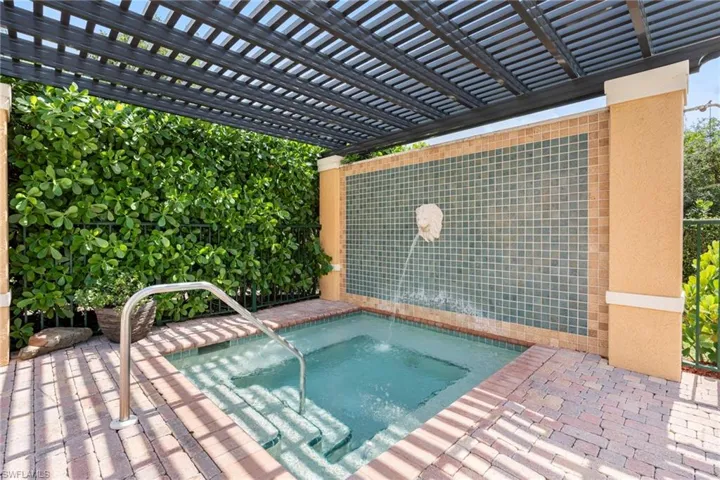 View of pool featuring a pergola, an in ground hot tub, and a patio area