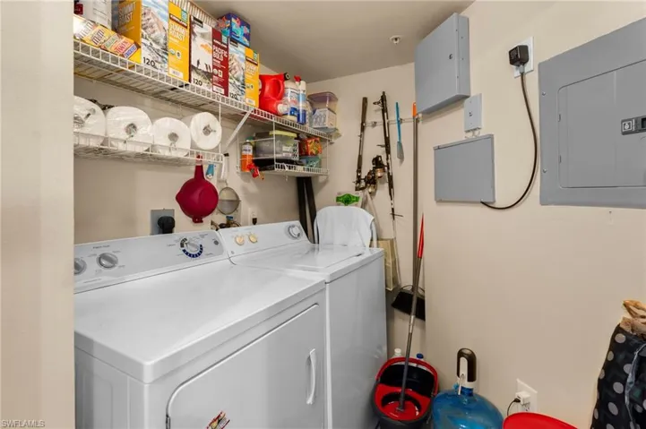 Clothes washing area with electric panel and washing machine and clothes dryer