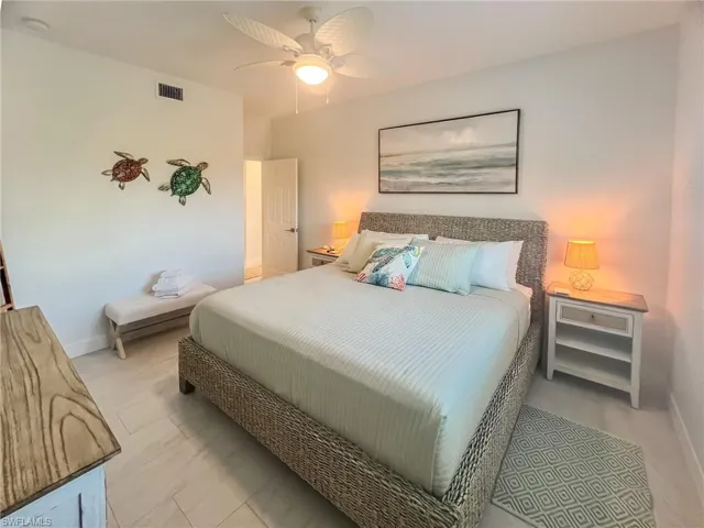 Bathroom featuring toilet and shower / tub combo with curtain