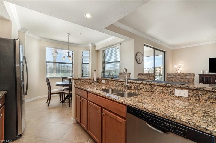 Kitchen has loads of light and views of the lake