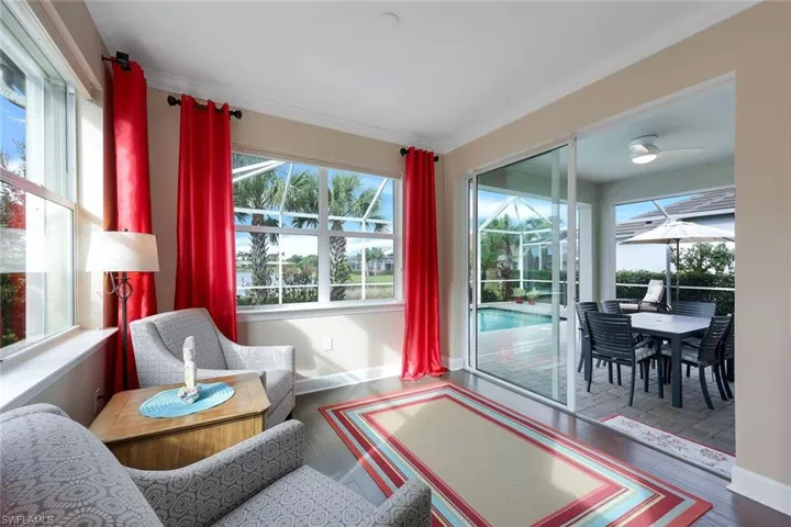 Sunroom featuring ceiling fan
