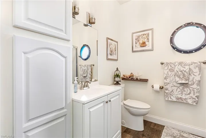 Bathroom featuring vanity and dark wood-type flooring
