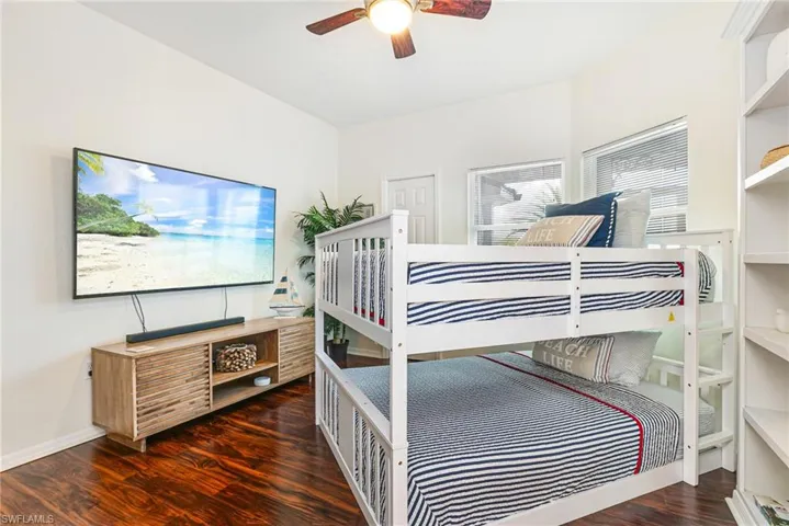 Bedroom featuring dark wood-style flooring and ceiling fan