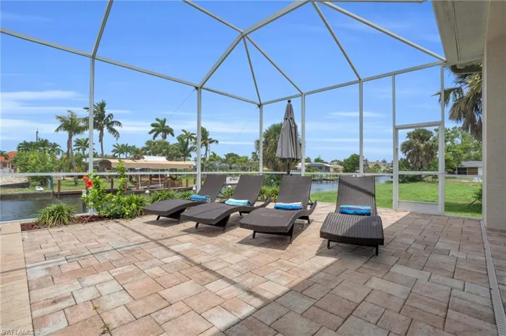 Unfurnished sunroom featuring a water view