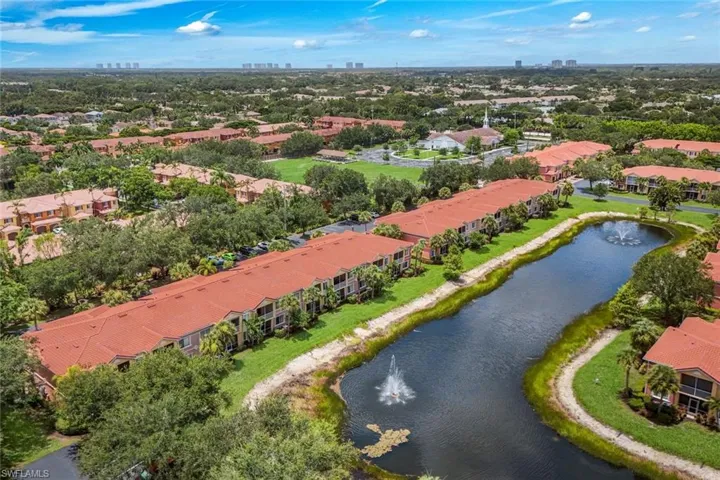 Expansive community featuring multi-story residences with terracotta-style roof tiles and private balconies