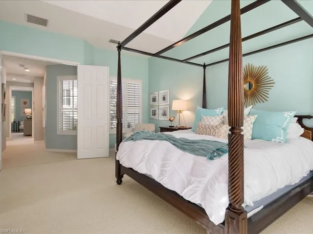 Carpeted bedroom with baseboards
