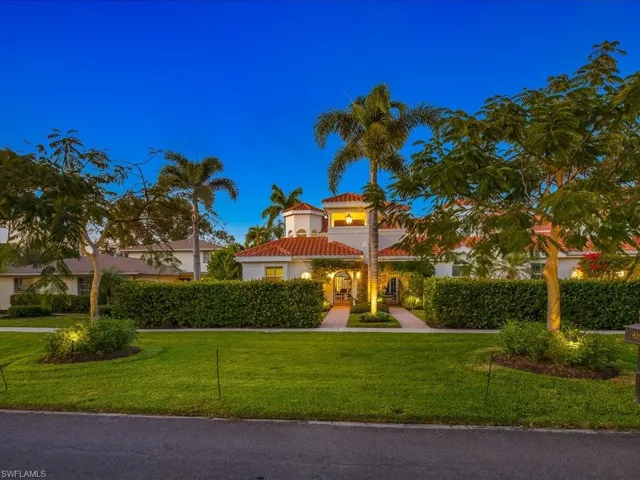 Mediterranean / spanish-style house featuring a front yard, stucco siding, and a tiled roof