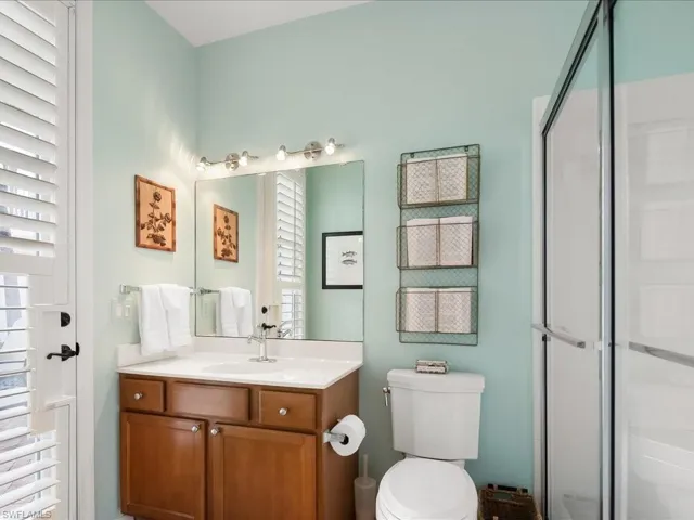 Bathroom with vanity and a stall shower