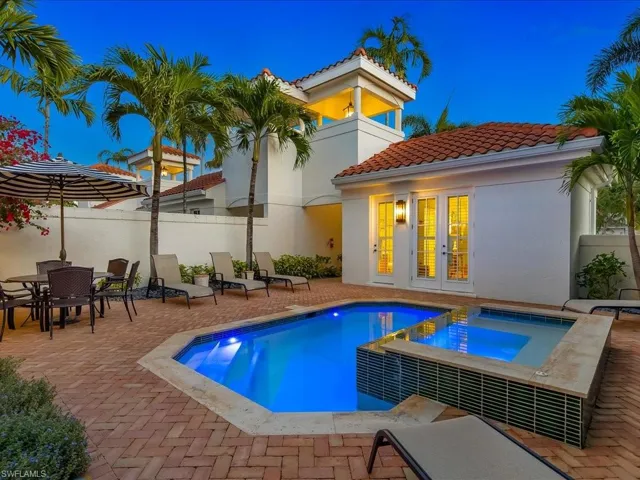 Integrated pool / hot tub featuring french doors, a patio area, and outdoor dining area
