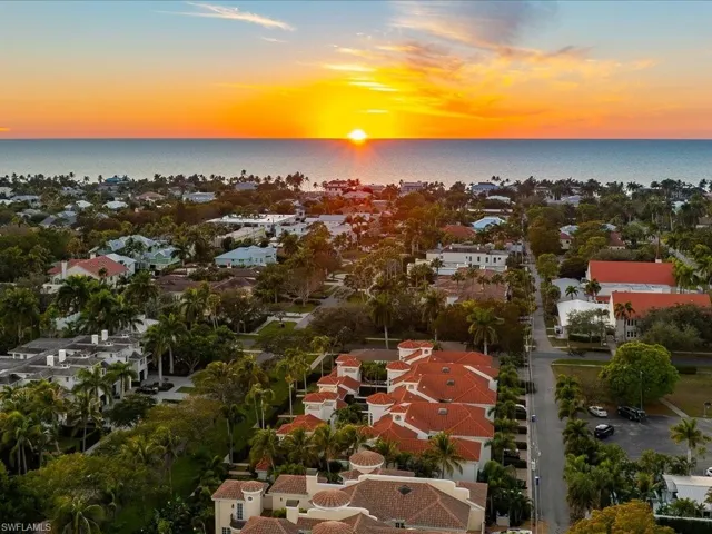 Aerial view at dusk of a residential view and a water view