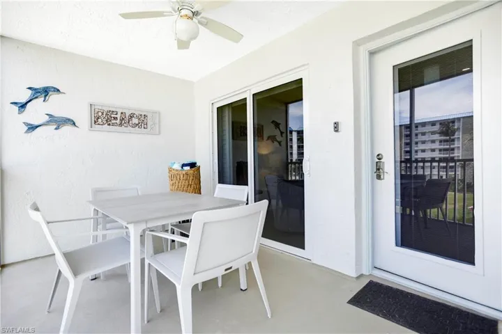 Spacious front balcony, new front door with inset blinds, impact glass.