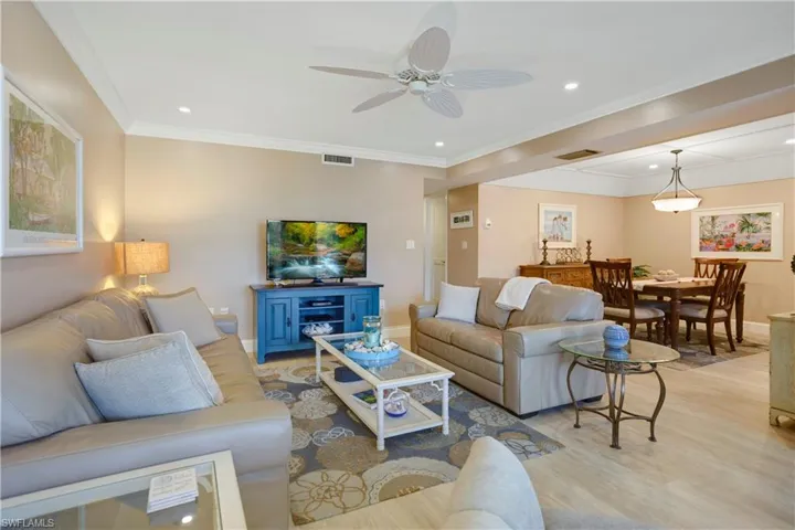 Crown molding, wide baseboards, open concept.