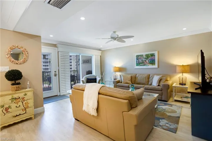 Spacious Great Room with recessed lights and plantation shutters