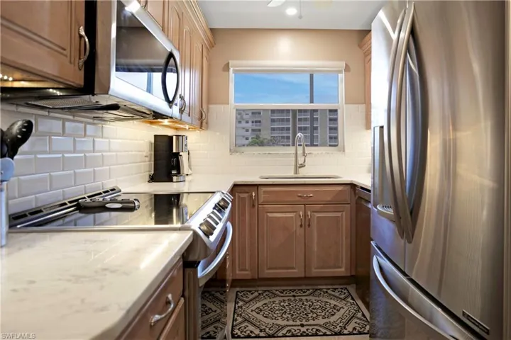 Brazilian Quartz counters, stainless appliances, custom wood cabinetry.
