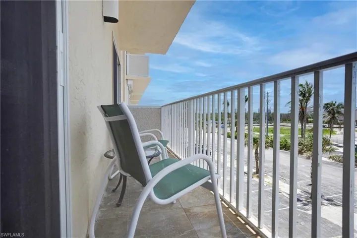 Both bedroom sliders lead out to an open shared back balcony!