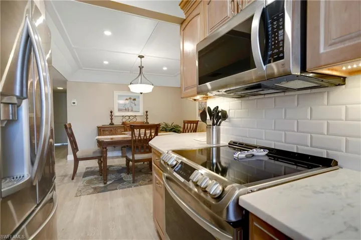 Elongated kitchen opens up to the dining room.