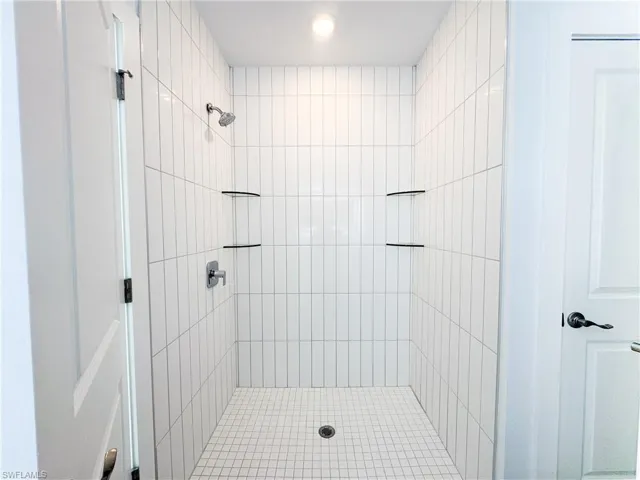 Full bathroom with tiled shower