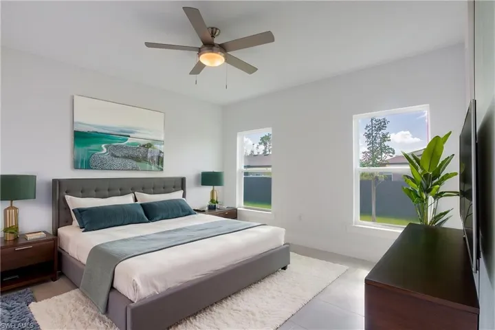 Bedroom with baseboards and a ceiling fan