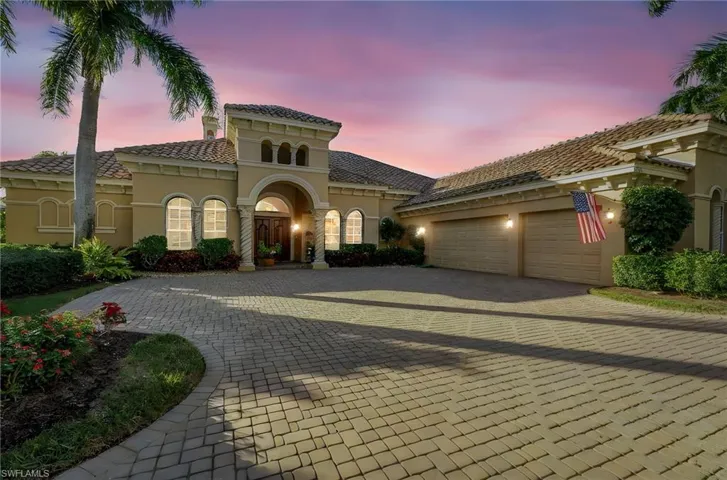 Mediterranean / spanish house featuring stucco siding, decorative driveway, a tile roof, and a garage