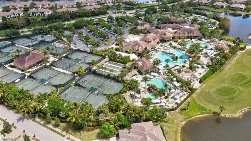 Aerial overview of property's location featuring a large body of water and nearby suburban area