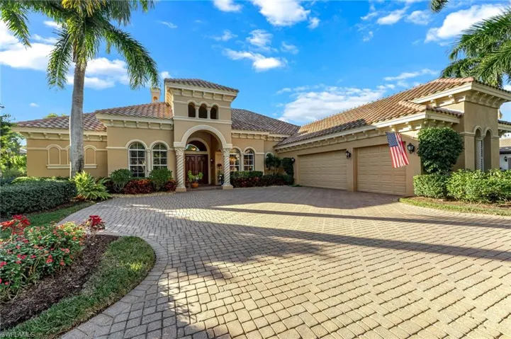 Mediterranean / spanish-style home with stucco siding, decorative driveway, a tiled roof, and an attached garage