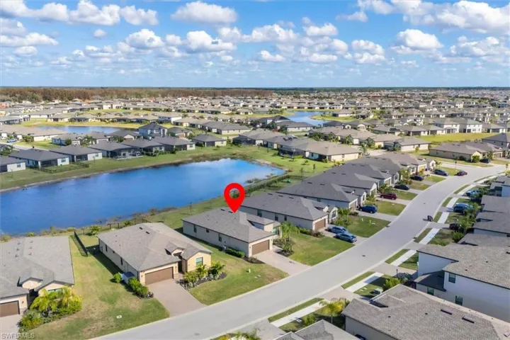 Aerial view of residential area featuring a large body of water