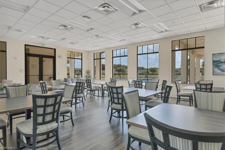 Dining area featuring a drop ceiling and wood finished floors