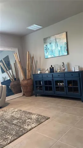 Neutral-toned tile flooring throughout