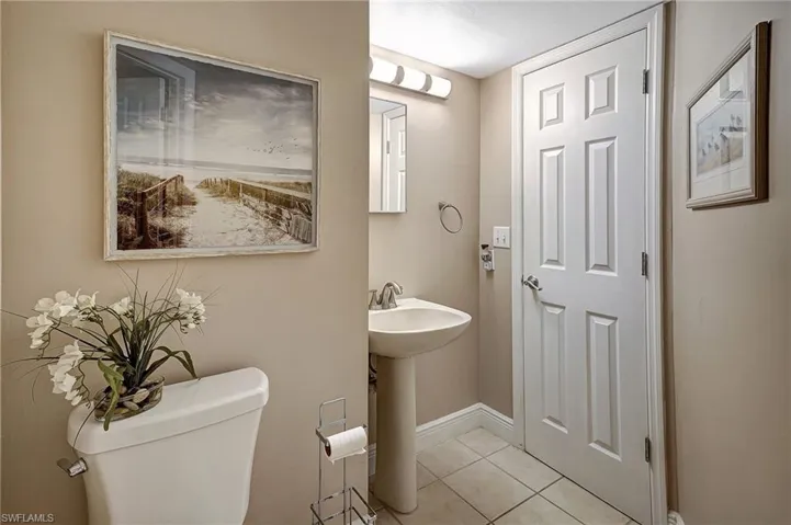 Bathroom with tile patterned floors and toilet