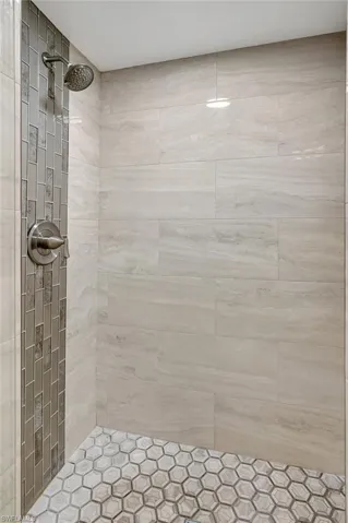 Bathroom featuring a tile shower
