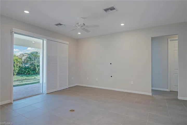 Great room with ceiling fan, recessed lighting, and light tile patterned flooring