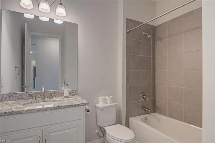 Full bathroom featuring tub / shower combination and vanity