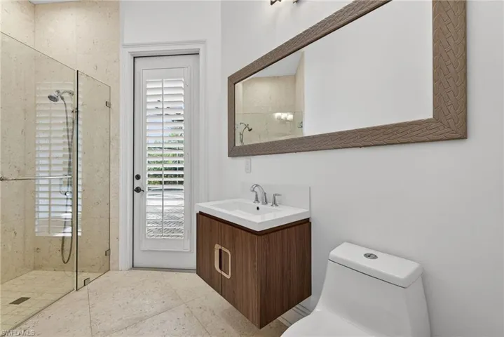 Full bathroom featuring a shower stall and vanity