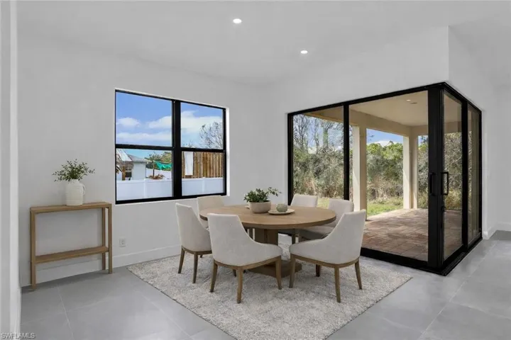 Dining area featuring baseboards and recessed lighting. This photo was digitally staged.